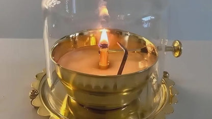Auspicious Akhand Jyot in golden brass, where the wick circles in divine rhythm